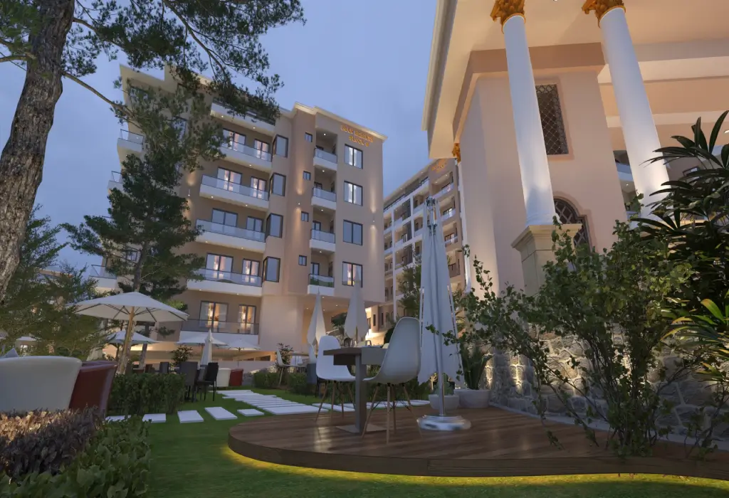 Iman Heights Murree residences among mature pine trees at dusk
